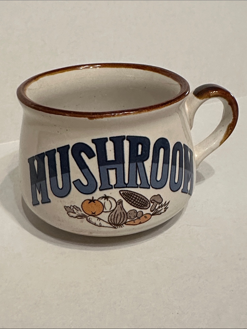 Cream Ceramic Mushroom Soup Coffee Mug with Blue Lettering and Brown Trim